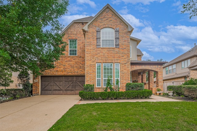 5442 Jackson Park Ln, Katy, TX 77494 - traditional home with brick siding, a garage, a front yard, and concrete driveway
