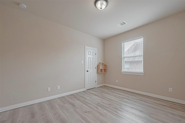 5442 Jackson Park Ln, Katy, TX 77494 - empty room featuring light wood-type flooring, baseboards, and a smoke detector