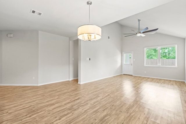18061 Atwood Mill Dr, New Caney, TX 77357 - unfurnished room featuring light wood-style flooring, ceiling fan, lofted ceiling, and baseboards