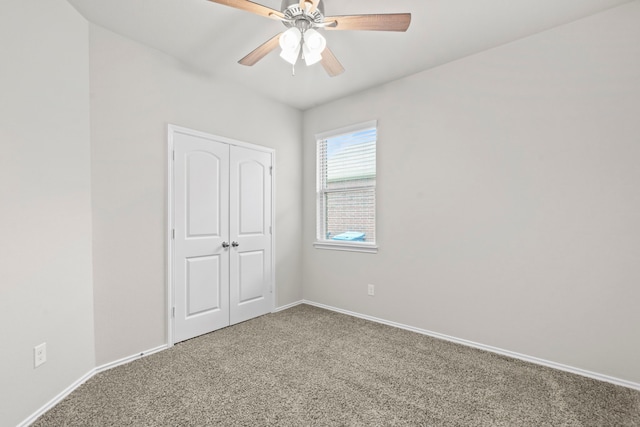 18061 Atwood Mill Dr, New Caney, TX 77357 - unfurnished bedroom with carpet, baseboards, a closet, and a ceiling fan