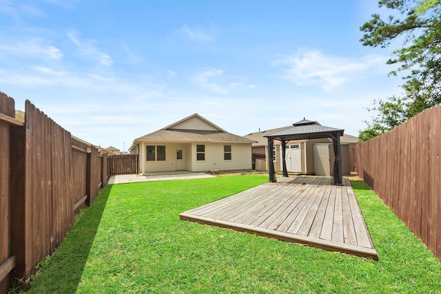 18061 Atwood Mill Dr, New Caney, TX 77357 - back of property with a gazebo and a wooden deck
