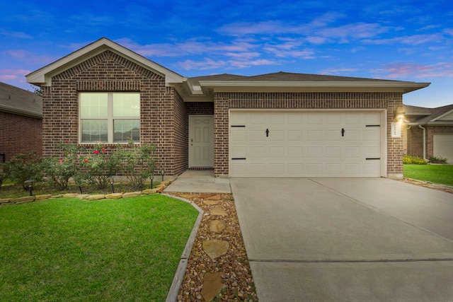 18061 Atwood Mill Dr, New Caney, TX 77357 - ranch-style house with brick siding, concrete driveway, an attached garage, and a lawn