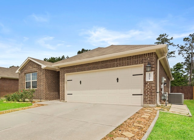 18061 Atwood Mill Dr, New Caney, TX 77357 - single story home with central AC, brick siding, concrete driveway, and a garage