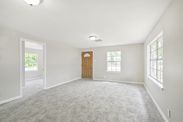 4803 W Bayshore Dr, Bacliff, TX 77518 - spare room featuring healthy amount of natural light, carpet, and baseboards