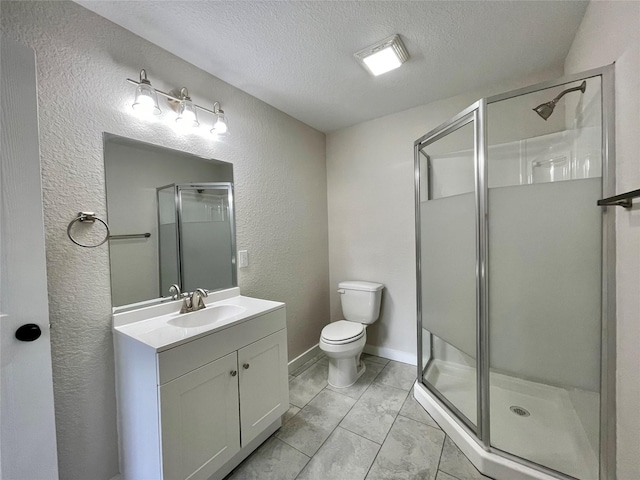 527 W 4th St, Freeport, TX 77541 - full bathroom featuring vanity, a textured wall, a stall shower, toilet, and a textured ceiling