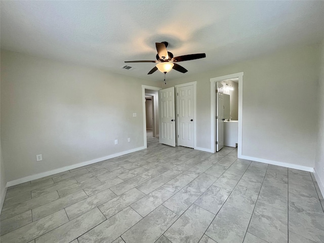 527 W 4th St, Freeport, TX 77541 - unfurnished bedroom featuring baseboards and ceiling fan
