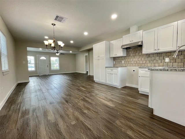 527 W 4th St, Freeport, TX 77541 - kitchen with a chandelier, open floor plan, white cabinetry, decorative backsplash, and recessed lighting