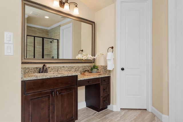 19023 Wild Thornberry Dr, Tomball, TX 77377 - bathroom with a shower stall, vanity, baseboards, and crown molding