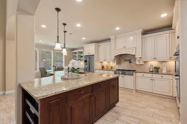 19023 Wild Thornberry Dr, Tomball, TX 77377 - kitchen featuring stainless steel appliances, dark brown cabinets, backsplash, white cabinets, and recessed lighting