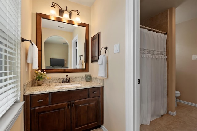 19023 Wild Thornberry Dr, Tomball, TX 77377 - bathroom featuring vanity, toilet, baseboards, tile patterned floors, and a shower with curtain