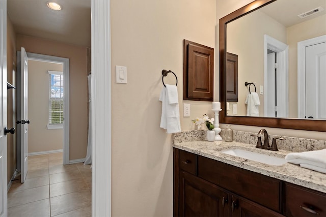 19023 Wild Thornberry Dr, Tomball, TX 77377 - bathroom with vanity, baseboards, and tile patterned flooring