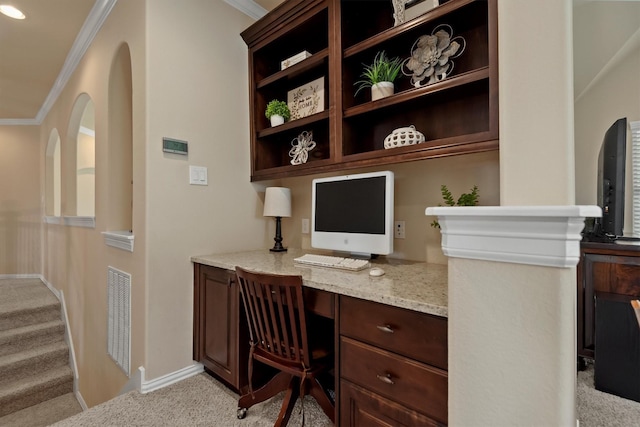 19023 Wild Thornberry Dr, Tomball, TX 77377 - home office featuring light colored carpet, built in desk, crown molding, and baseboards
