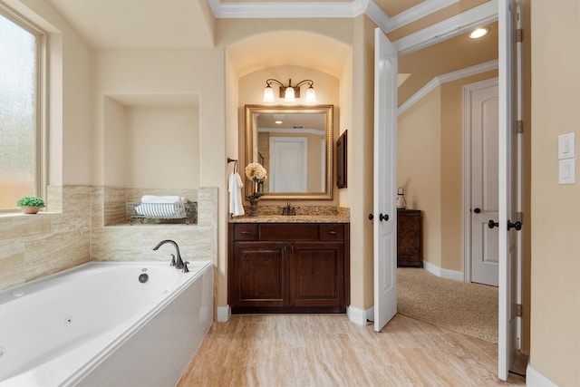 19023 Wild Thornberry Dr, Tomball, TX 77377 - full bath featuring vanity, a tub with jets, healthy amount of natural light, ornamental molding, and baseboards