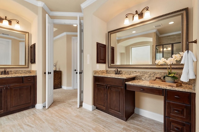 19023 Wild Thornberry Dr, Tomball, TX 77377 - bathroom with two vanities, a shower stall, crown molding, baseboards, and recessed lighting