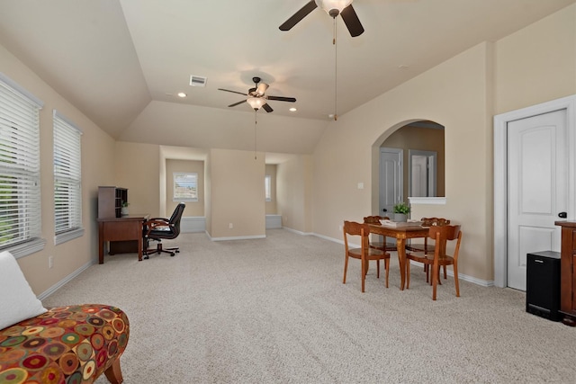 19023 Wild Thornberry Dr, Tomball, TX 77377 - home office featuring lofted ceiling, a ceiling fan, light colored carpet, arched walkways, and baseboards
