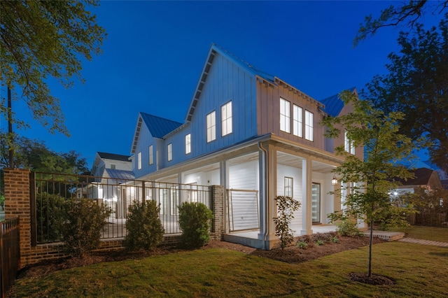 711 E 12th St, Houston, TX 77008 - view of side of property with board and batten siding, metal roof, and a standing seam roof