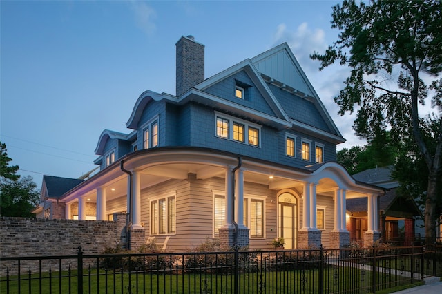 711 E 12th St, Houston, TX 77008 - view of front of property featuring covered porch, a chimney, and a fenced front yard