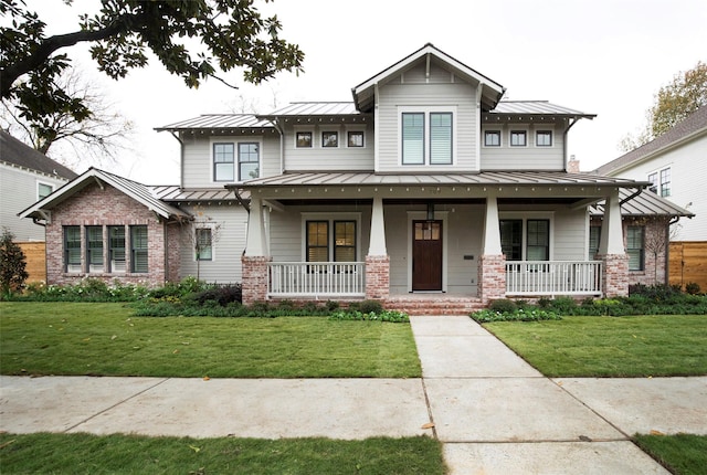 711 E 12th St, Houston, TX 77008 - craftsman house featuring a standing seam roof, covered porch, and metal roof