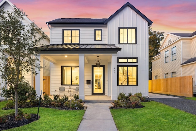 711 E 12th St, Houston, TX 77008 - modern inspired farmhouse featuring a standing seam roof, covered porch, board and batten siding, and metal roof