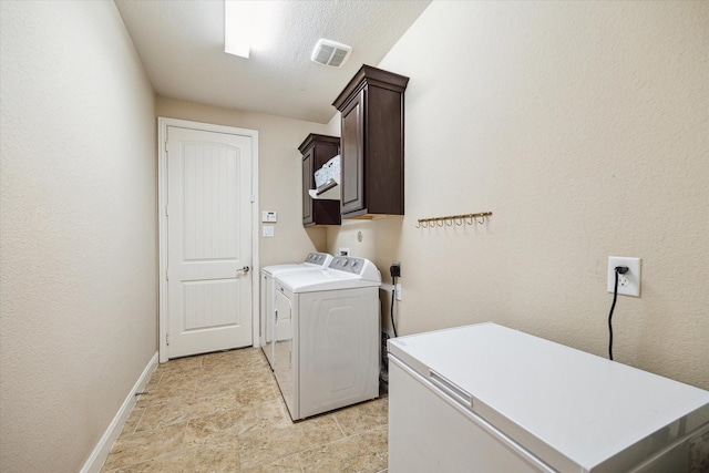 21307 Plum Gate Ct, Richmond, TX 77407 - washroom with cabinet space, washer and clothes dryer, and baseboards