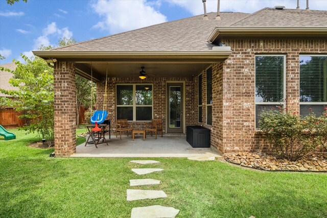 21307 Plum Gate Ct, Richmond, TX 77407 - rear view of house featuring brick siding, a ceiling fan, a shingled roof, and a patio area