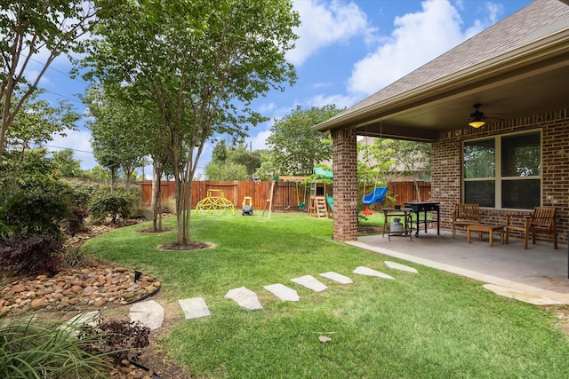 21307 Plum Gate Ct, Richmond, TX 77407 - view of yard with a playground, a ceiling fan, and a patio area