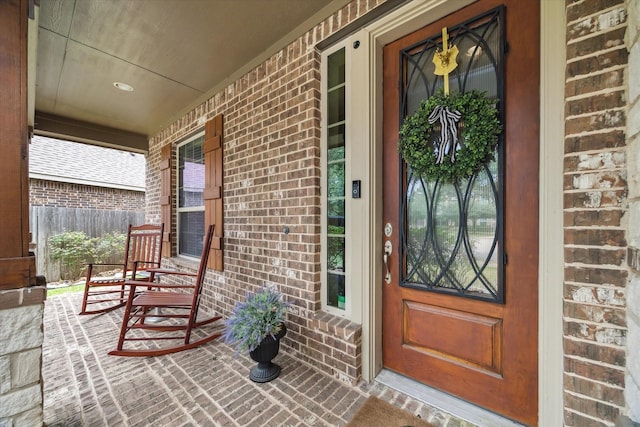 21307 Plum Gate Ct, Richmond, TX 77407 - view of exterior entry featuring covered porch and brick siding