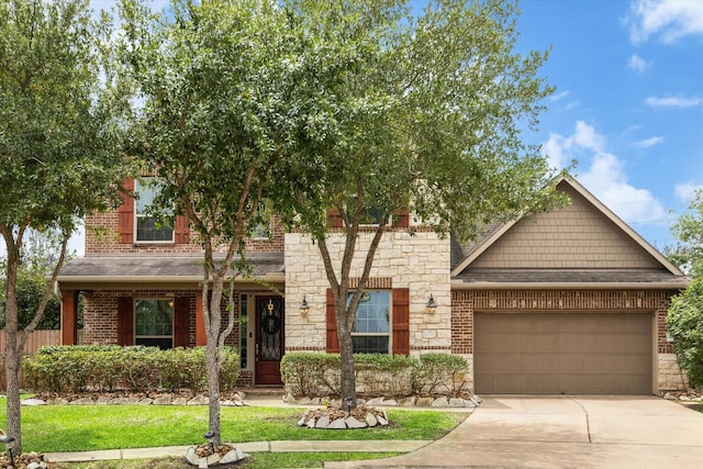 21307 Plum Gate Ct, Richmond, TX 77407 - view of front facade featuring brick siding, concrete driveway, an attached garage, stone siding, and roof with shingles