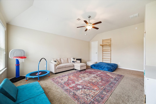 21307 Plum Gate Ct, Richmond, TX 77407 - carpeted living area featuring vaulted ceiling, ceiling fan, and baseboards