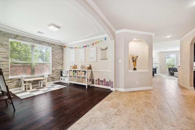 21307 Plum Gate Ct, Richmond, TX 77407 - sitting room with ornamental molding, arched walkways, a fireplace, and baseboards