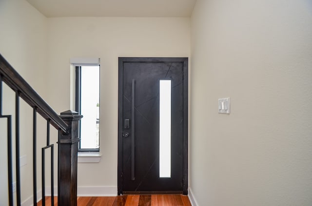 3626 Dreyfus St, Houston, TX 77021 - entrance foyer featuring wood finished floors, baseboards, and stairs