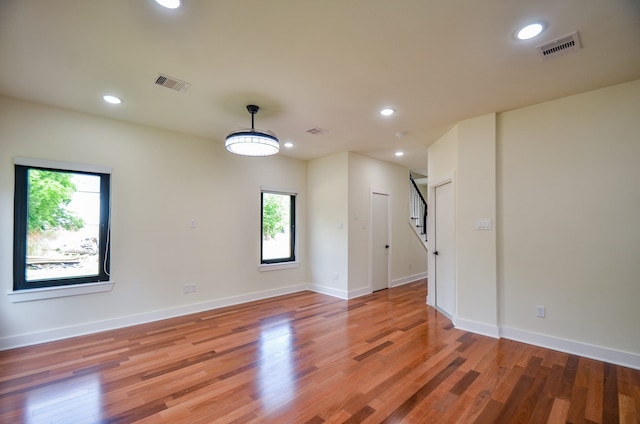 3626 Dreyfus St, Houston, TX 77021 - unfurnished room featuring plenty of natural light, stairway, recessed lighting, light wood-type flooring, and baseboards