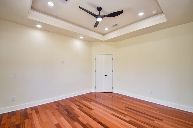 3626 Dreyfus St, Houston, TX 77021 - unfurnished room featuring a raised ceiling, ornamental molding, ceiling fan, light wood-style flooring, and baseboards