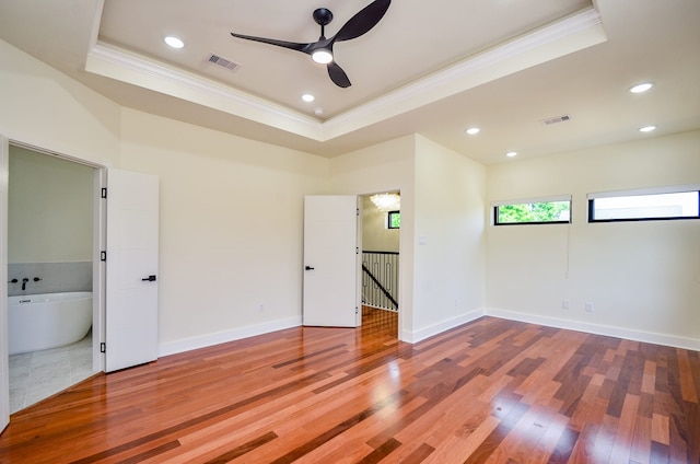 3626 Dreyfus St, Houston, TX 77021 - unfurnished room featuring ornamental molding, a tray ceiling, a ceiling fan, wood finished floors, and baseboards