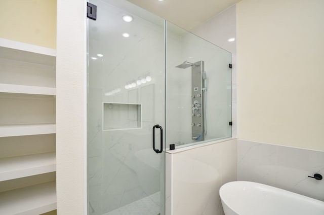 3626 Dreyfus St, Houston, TX 77021 - full bath with a shower stall, a soaking tub, tile walls, and recessed lighting