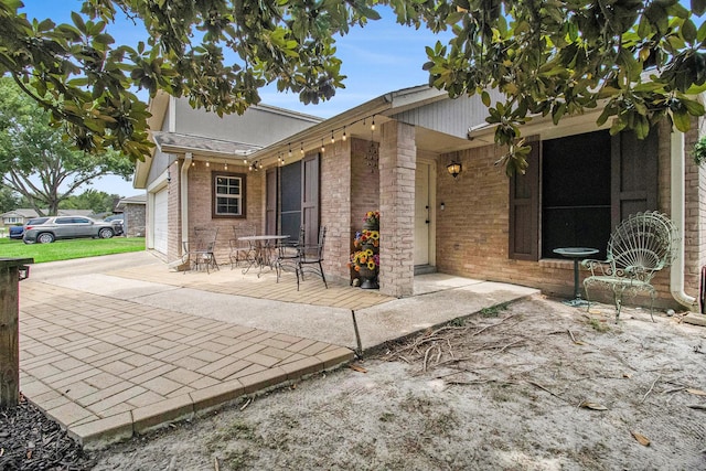 7914 Woodsman Trl, Houston, TX 77040 - view of patio / terrace featuring a garage and concrete driveway