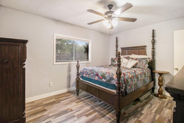 7914 Woodsman Trl, Houston, TX 77040 - bedroom featuring light wood finished floors, baseboards, and a ceiling fan