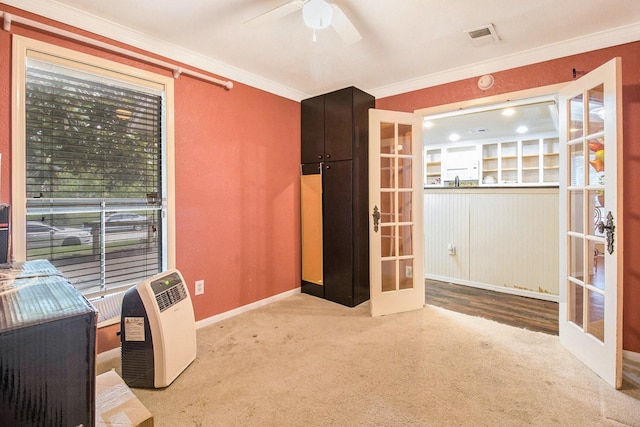 7914 Woodsman Trl, Houston, TX 77040 - unfurnished room with french doors, ornamental molding, ceiling fan, carpet flooring, and baseboards