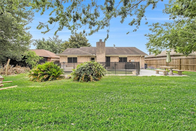 7914 Woodsman Trl, Houston, TX 77040 - back of house with brick siding, a patio area, and a chimney