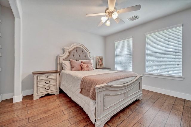 17815 Gables Bend Dr, Tomball, TX 77377 - bedroom featuring baseboards, light wood-style floors, and ceiling fan