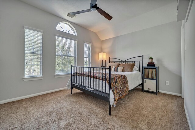 17815 Gables Bend Dr, Tomball, TX 77377 - bedroom with multiple windows, carpet flooring, vaulted ceiling, and baseboards