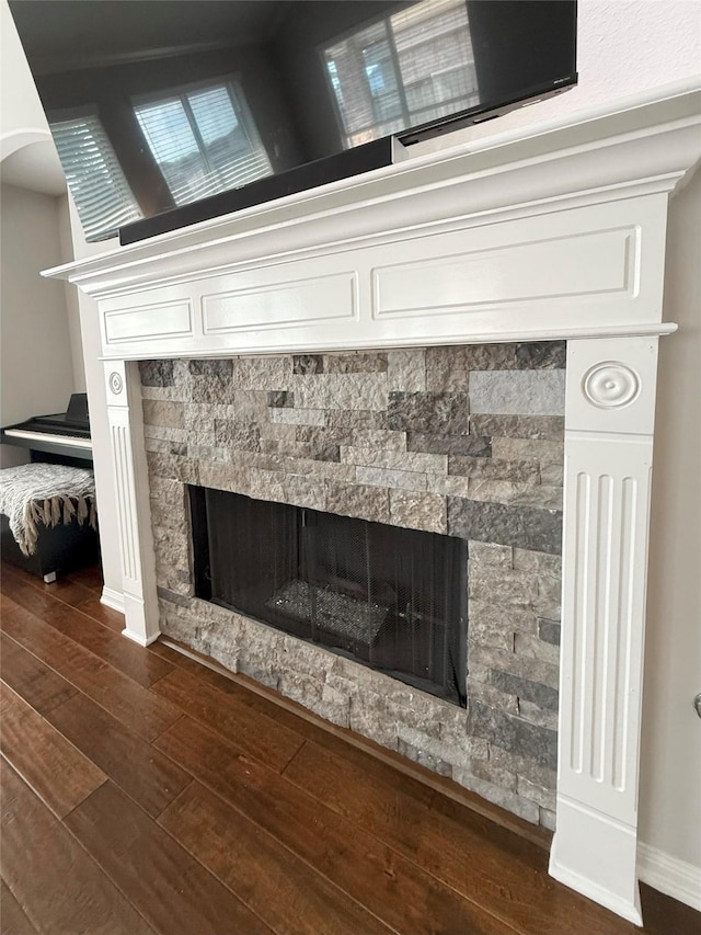 17815 Gables Bend Dr, Tomball, TX 77377 - detailed view of a fireplace, wood finished floors, and baseboards