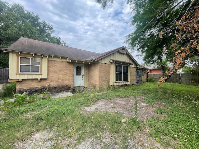 623 E Canino Rd, Houston, TX 77037 - ranch-style home featuring brick siding and roof with shingles