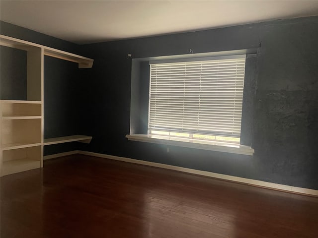 623 E Canino Rd, Houston, TX 77037 - empty room with wood finished floors and baseboards