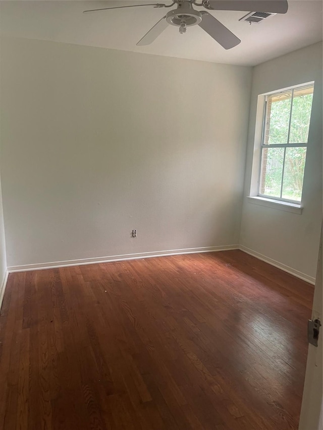 623 E Canino Rd, Houston, TX 77037 - unfurnished room featuring wood finished floors, a ceiling fan, and baseboards