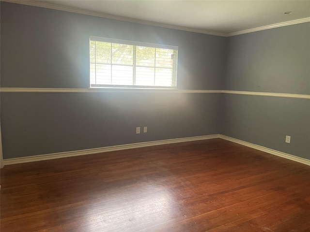 623 E Canino Rd, Houston, TX 77037 - spare room featuring dark wood-type flooring, baseboards, and crown molding