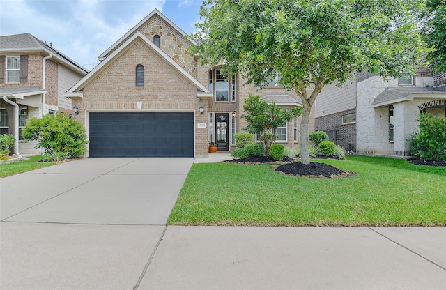 13705 Northline Lake Dr, Houston, TX 77044 - traditional-style home featuring brick siding, a front yard, and concrete driveway
