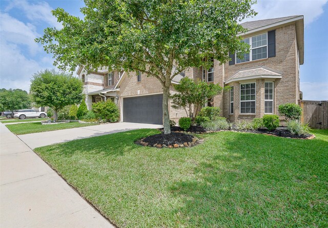 13705 Northline Lake Dr, Houston, TX 77044 - view of property hidden behind natural elements featuring brick siding, driveway, and a garage