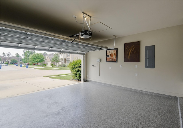 13705 Northline Lake Dr, Houston, TX 77044 - garage featuring electric panel, a garage door opener, and baseboards