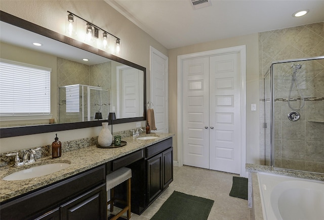 13705 Northline Lake Dr, Houston, TX 77044 - bathroom with a shower stall, double vanity, a bath, tile patterned flooring, and a closet